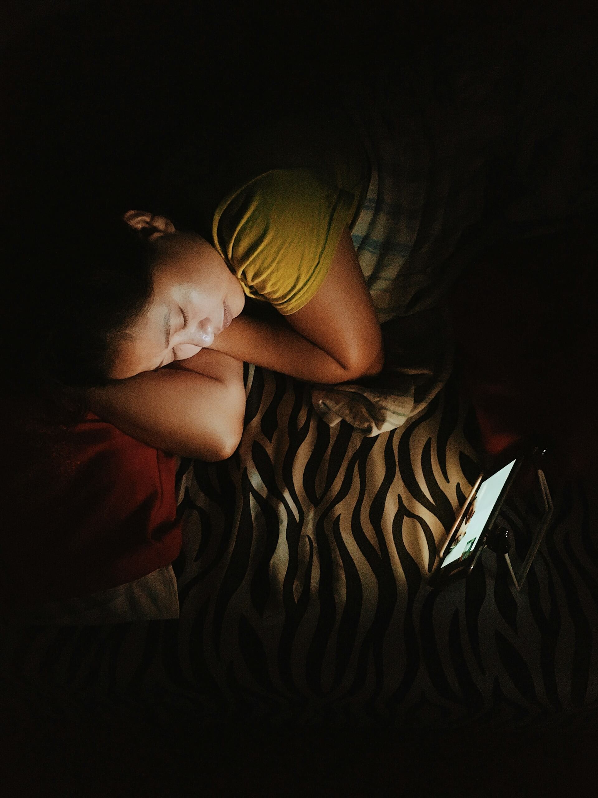 Electronic devices emit blue light that suppresses melatonin, the hormone responsible for making you sleepy.